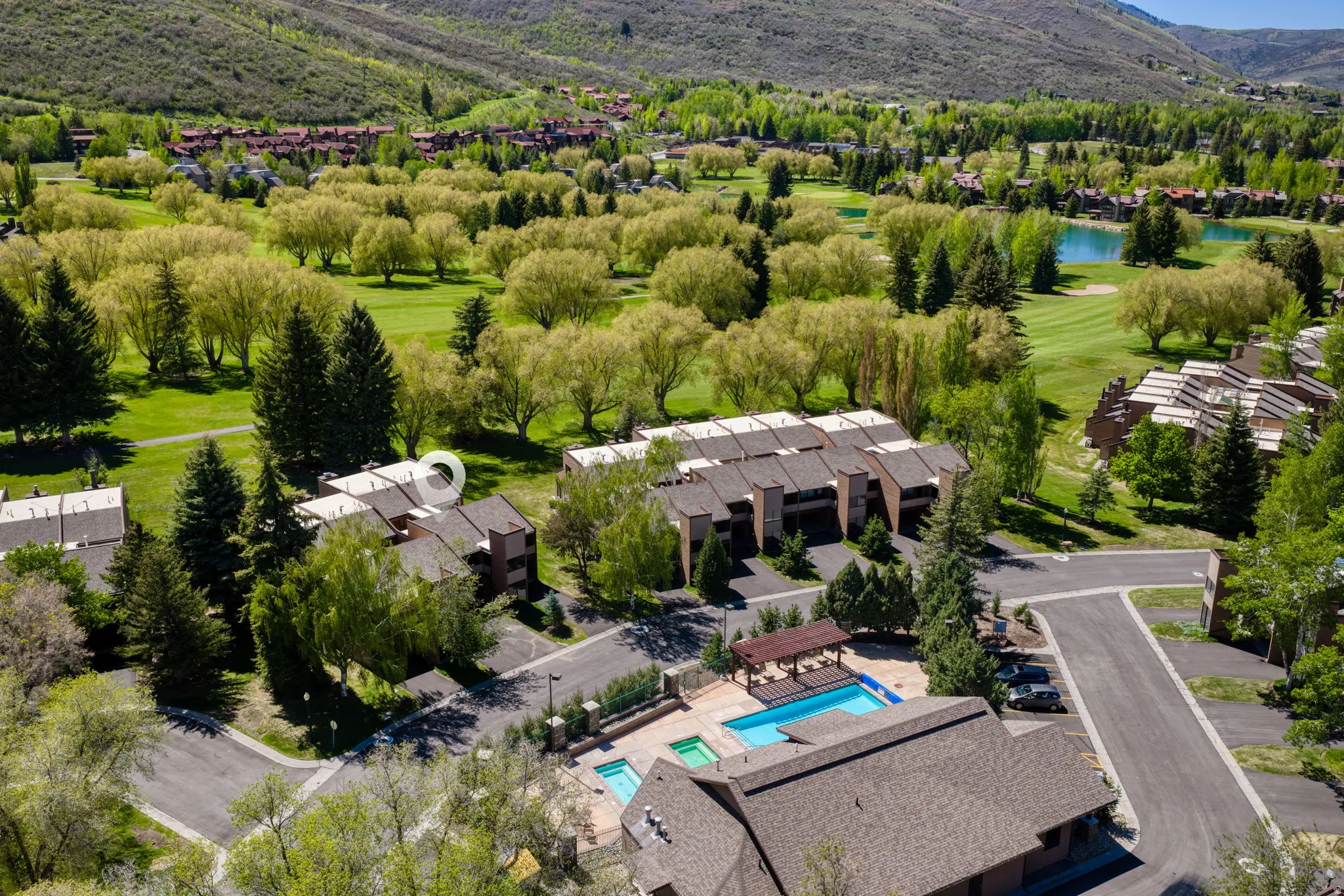 Aerial perspective highlighting multi-story structures with surrounding greenery