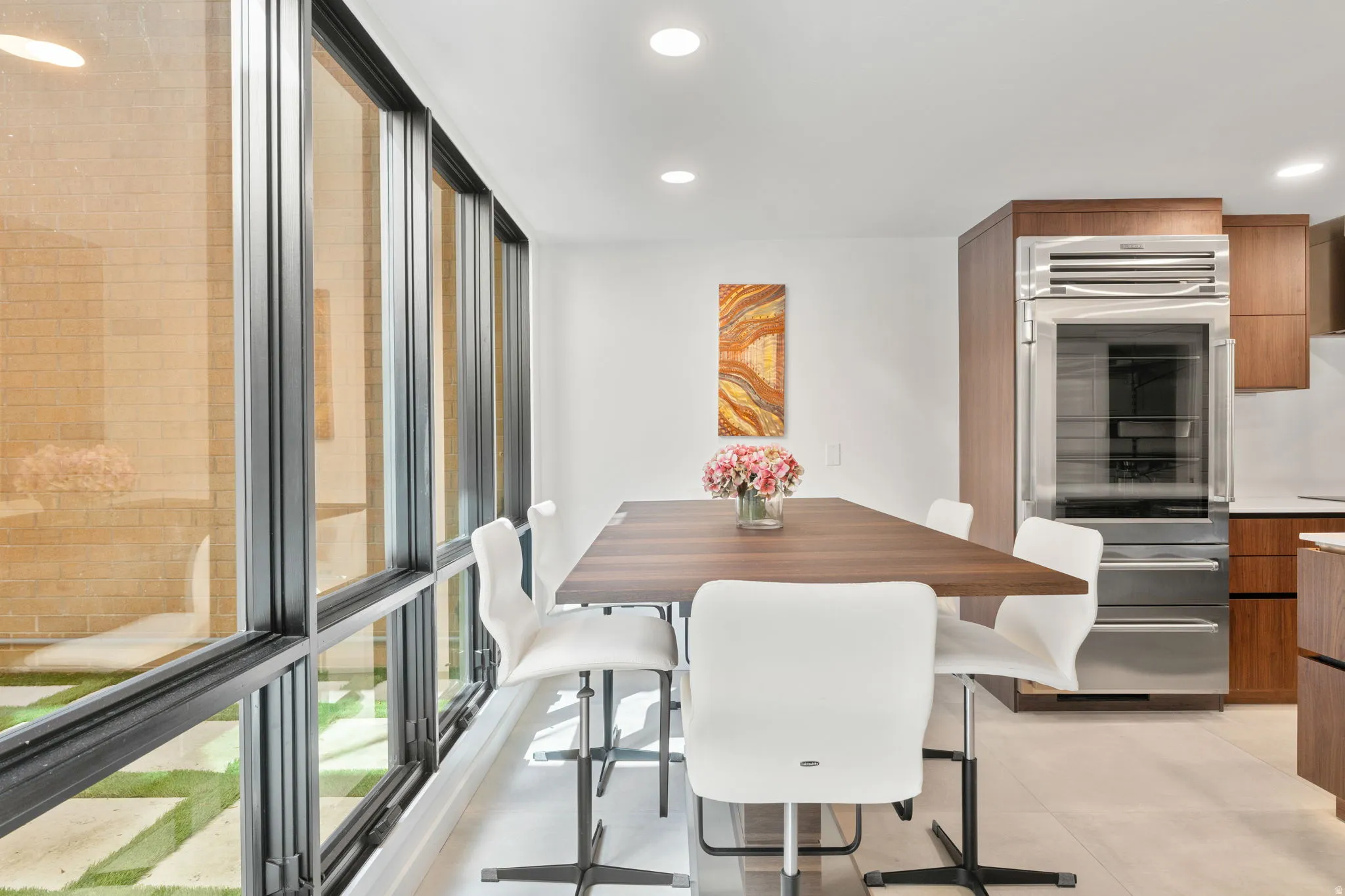 Expansive floor-to-ceiling windows with black frames