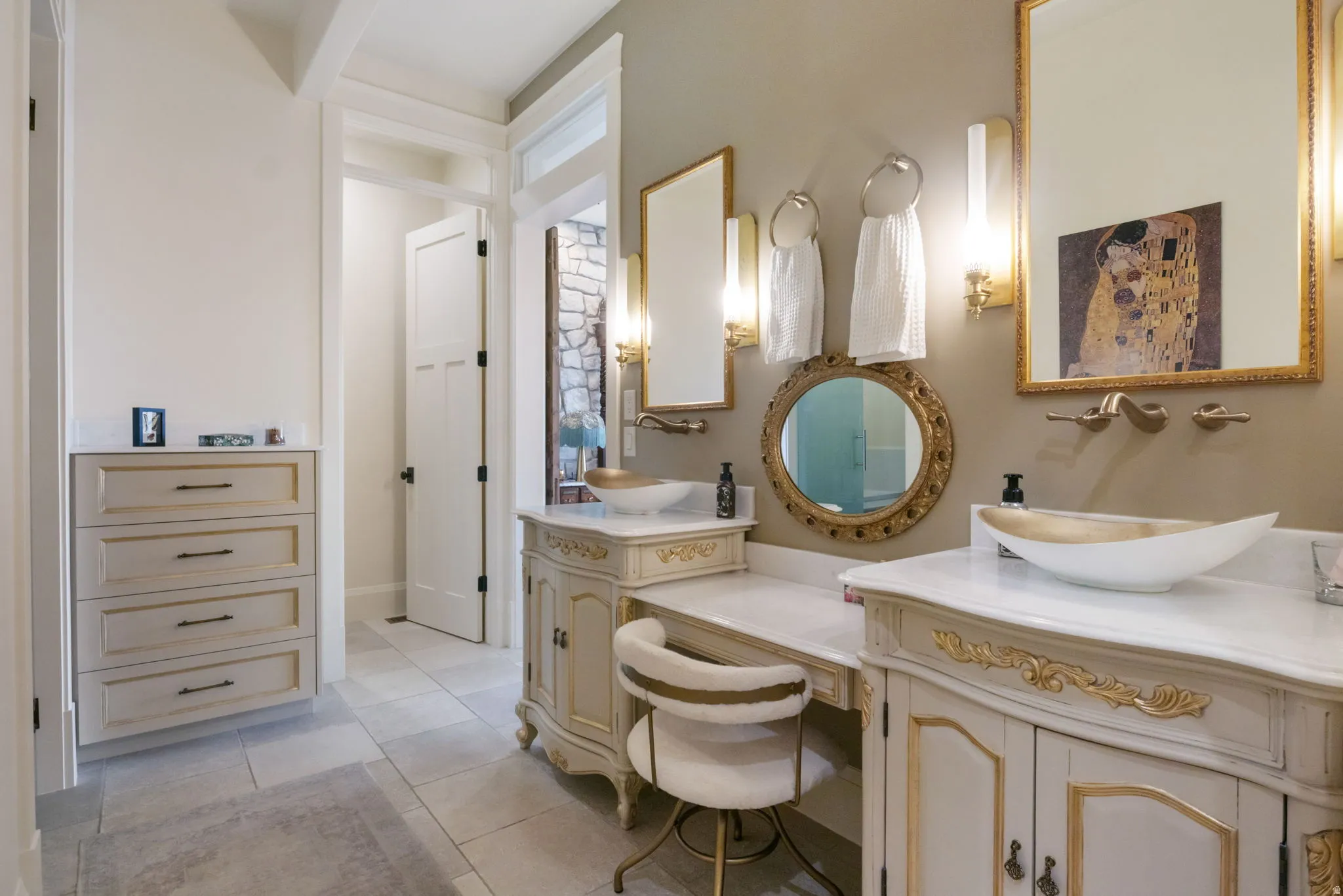 Dual vanity with vessel sinks and marble countertops
