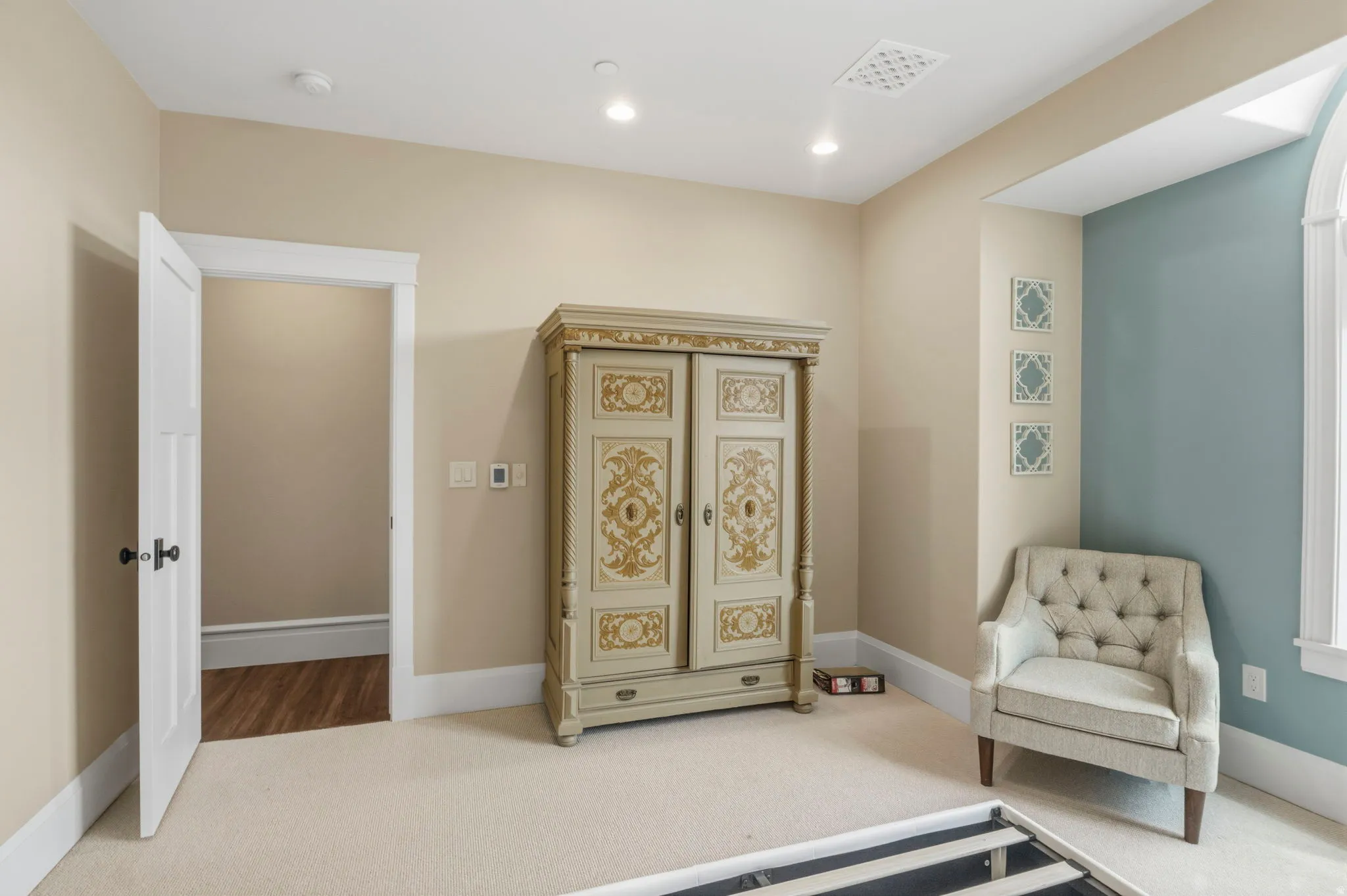 Cream-colored carpeting and neutral wall tones define this interior space