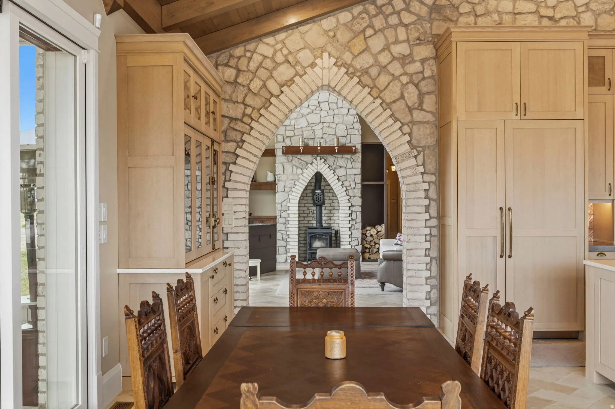 Dining area with a wood-finish vaulted ceiling and exposed beams