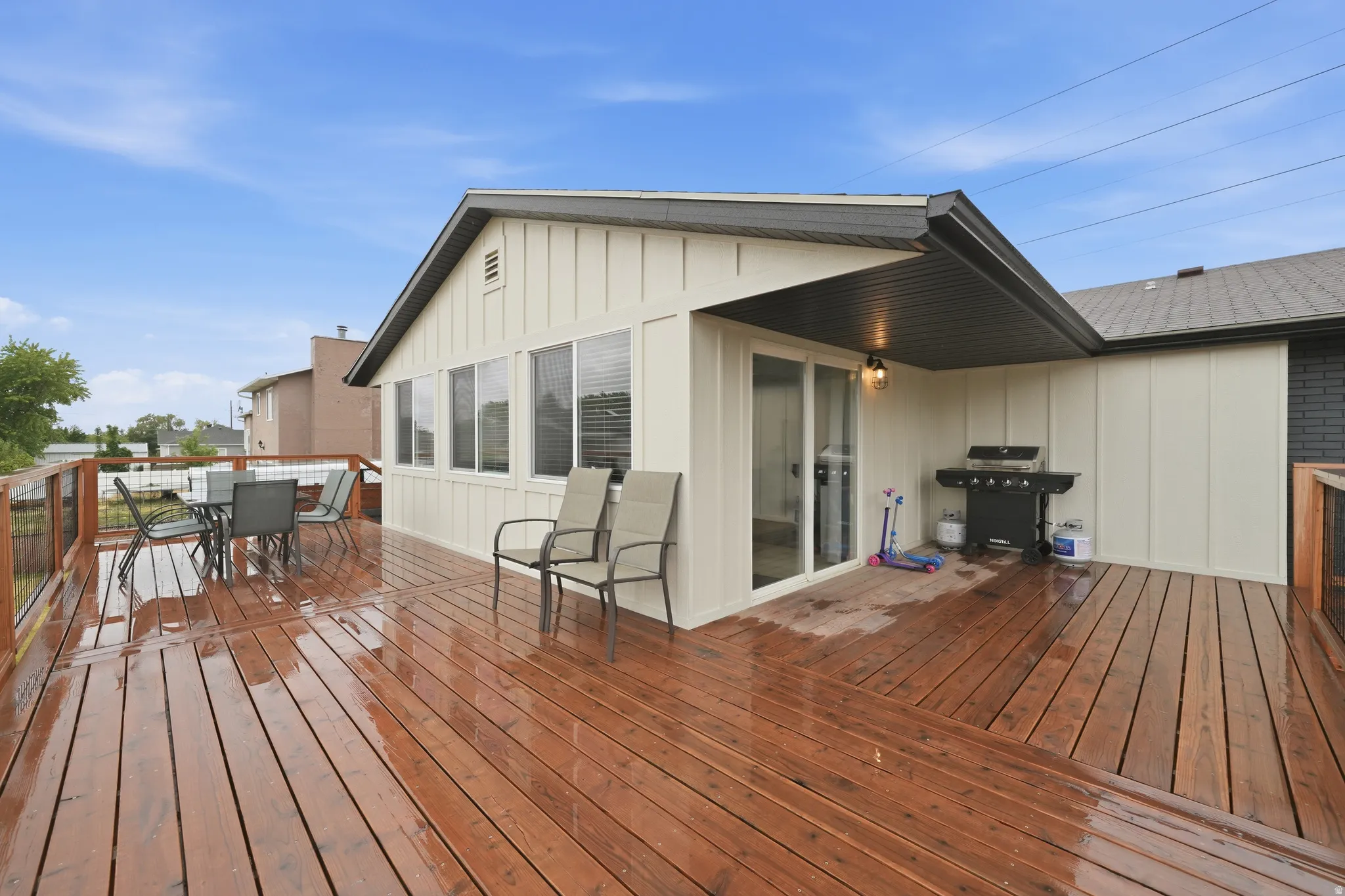 Spacious wood-finish deck with a metal railing system