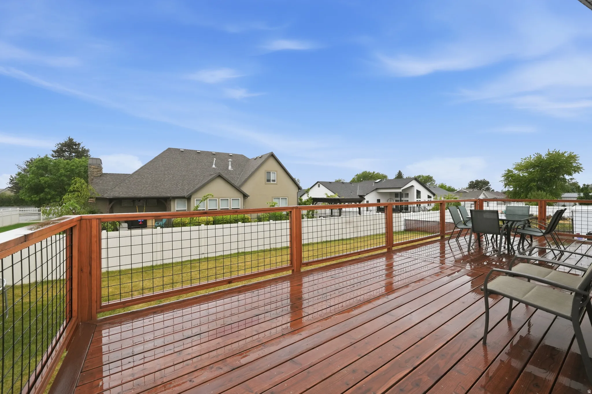 Spacious outdoor deck featuring rich wood-finish flooring