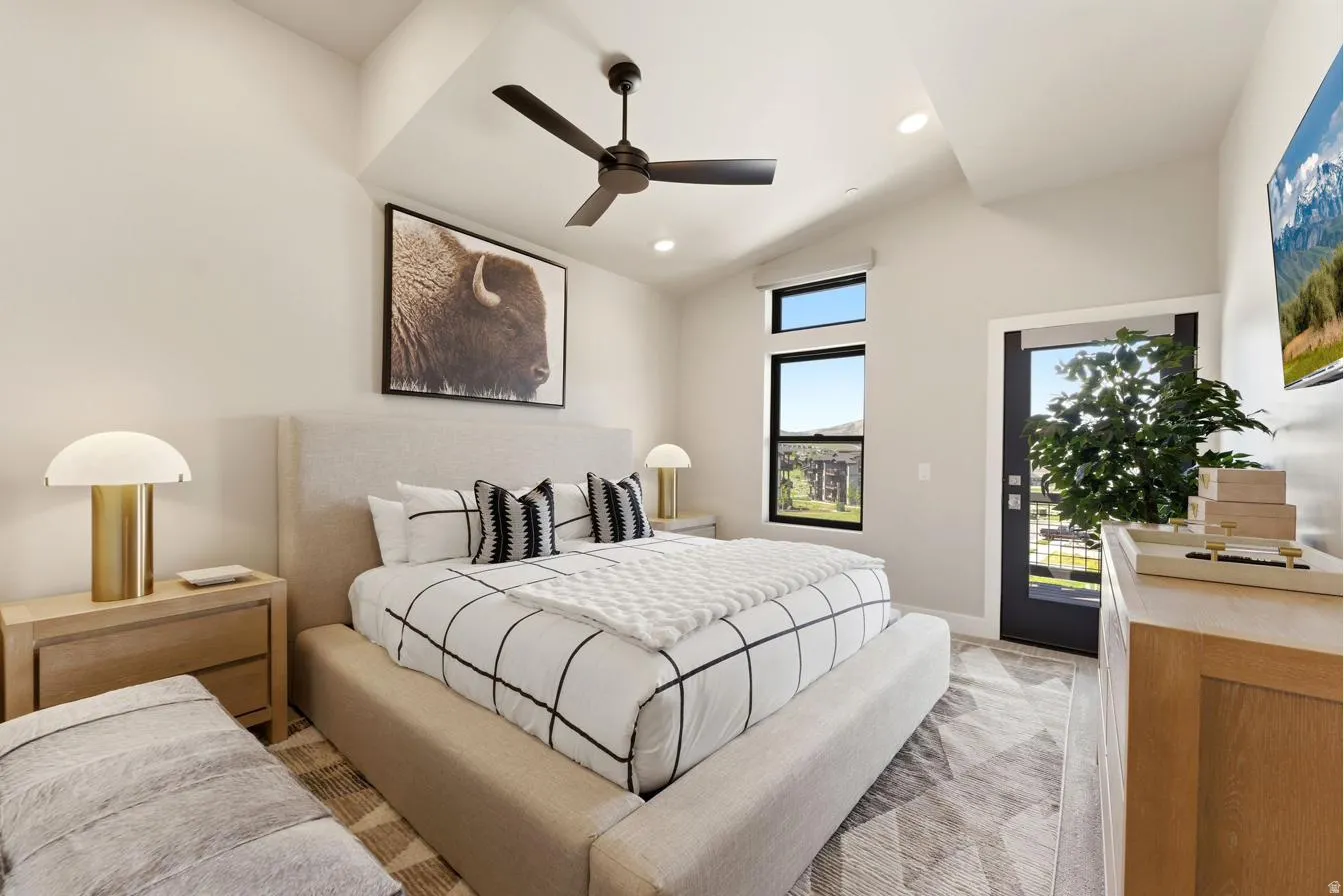 Vaulted ceilings with a ceiling fan and recessed lighting