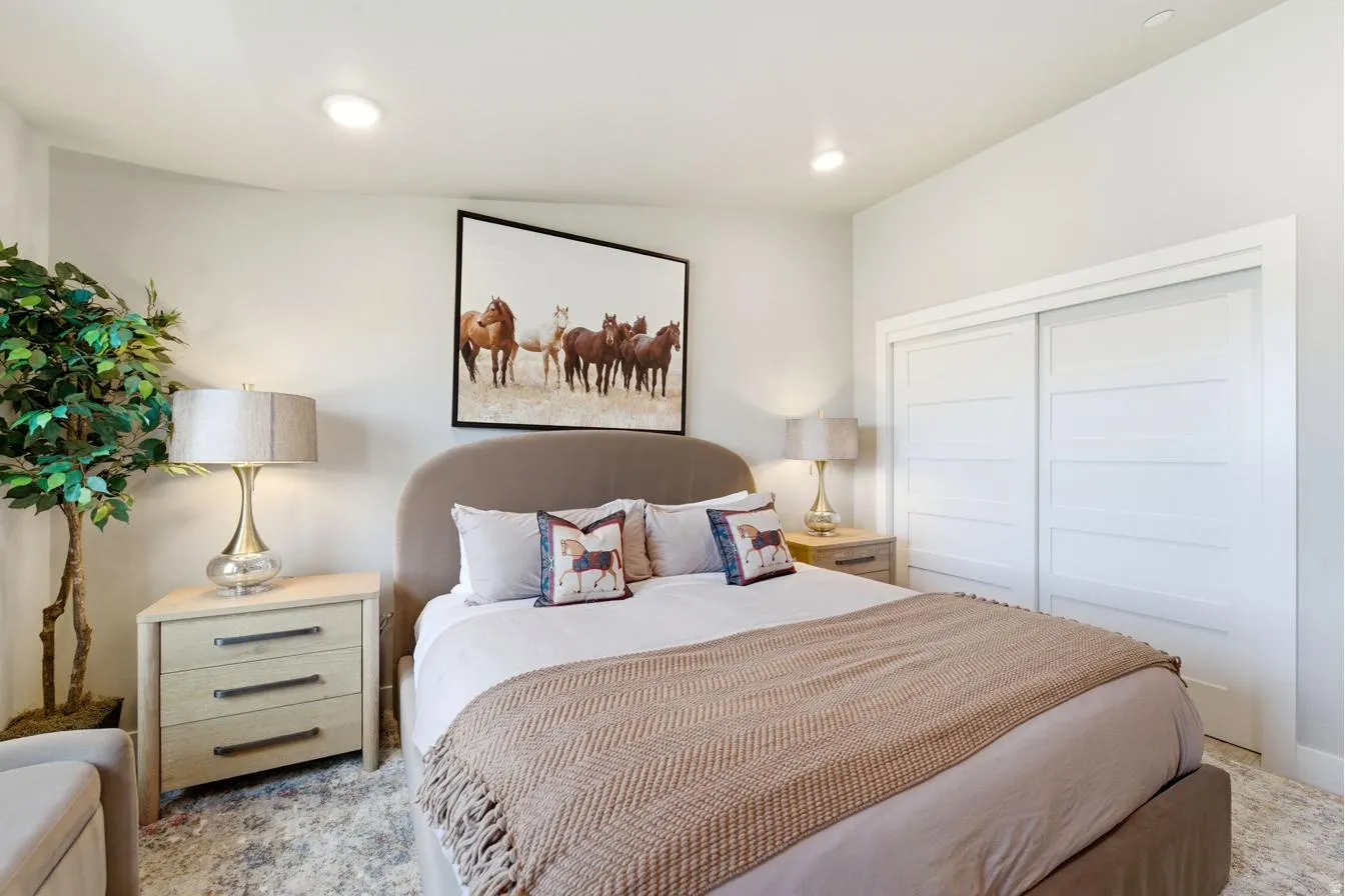 Bedroom featuring light-colored walls and recessed lighting