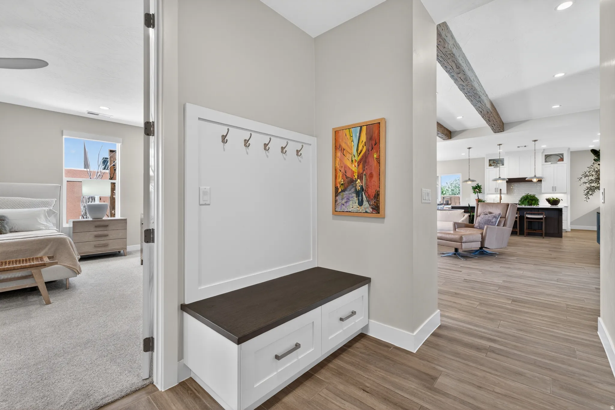 Built-in mudroom bench with storage drawers and wall-mounted hooks