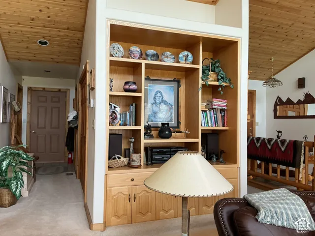 Built-in wood cabinetry with open shelving and lower storage