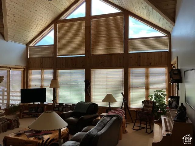 Vaulted wood-paneled ceiling with exposed beams