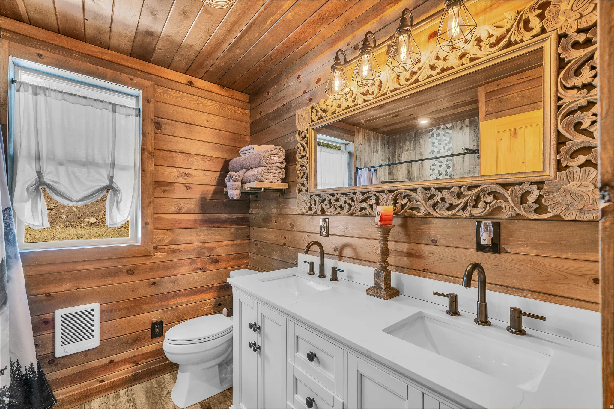 Bathroom featuring wood-finish plank walls and ceiling