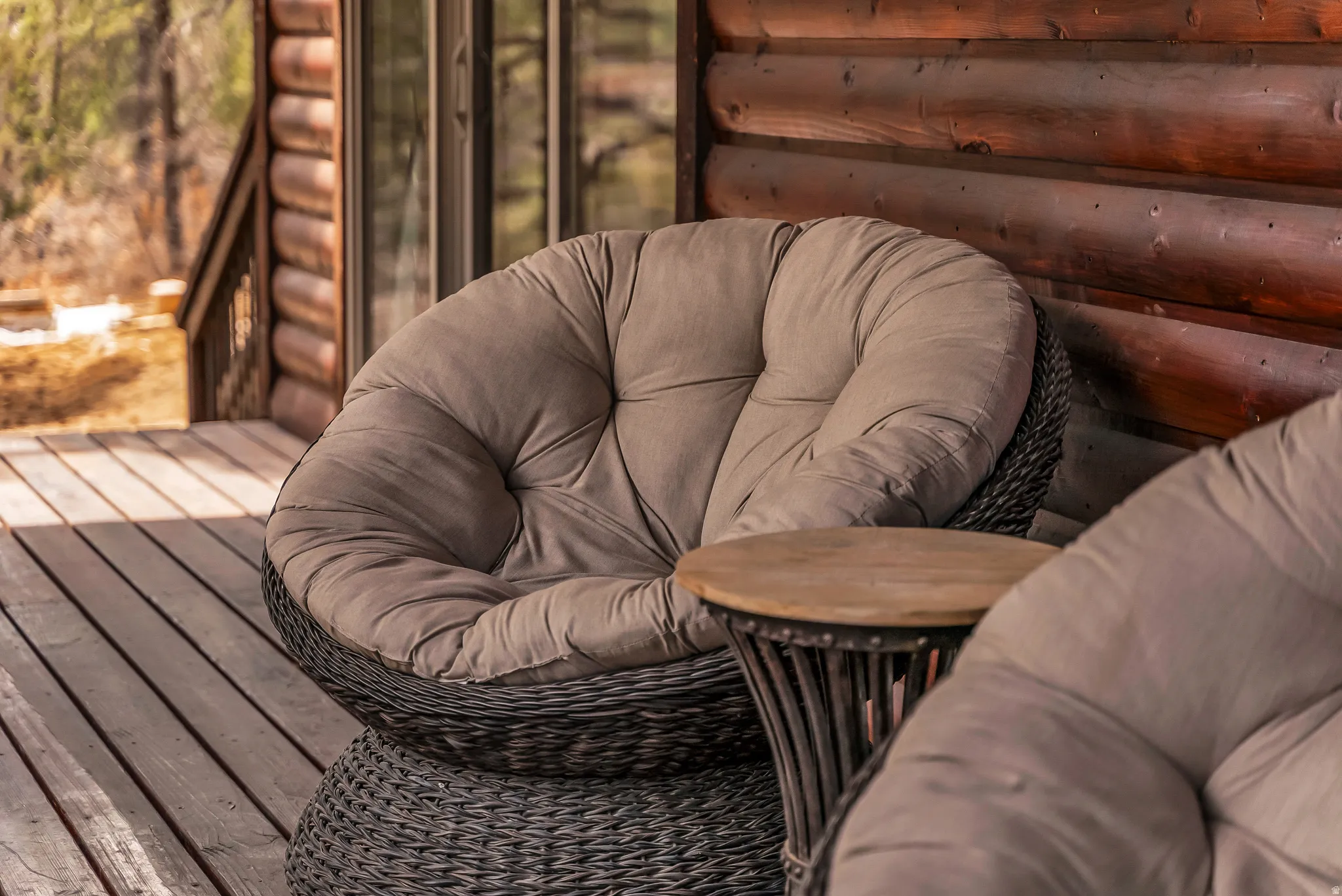 Wood-finish deck with a log cabin exterior wall