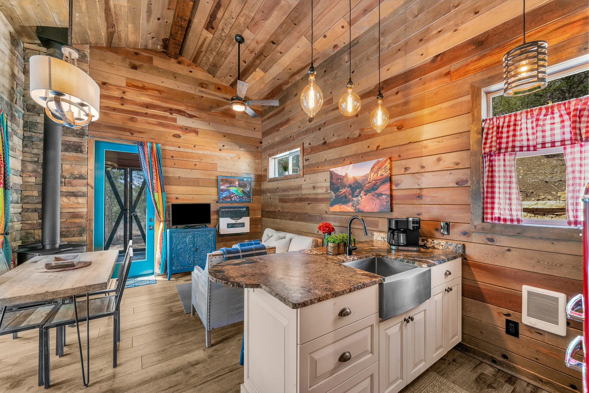 Interior featuring extensive wood-paneled walls and a vaulted wood-finish ceiling