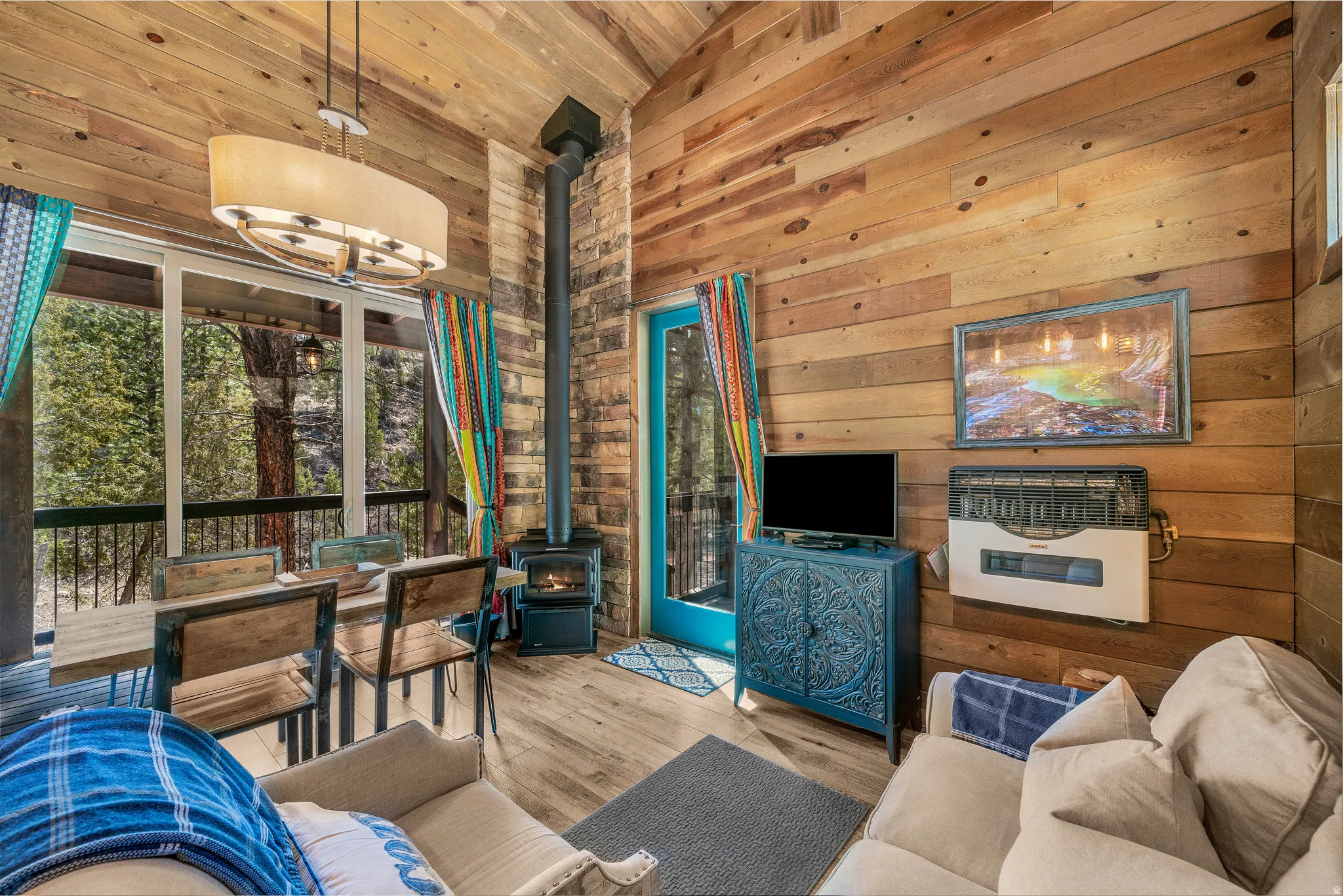 Interior featuring wood-finish flooring, wood plank walls, and a wood plank vaulted ceiling
