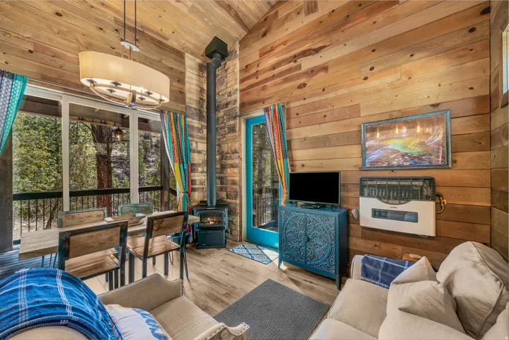 Interior featuring wood-finish flooring, wood plank walls, and a wood plank vaulted ceiling