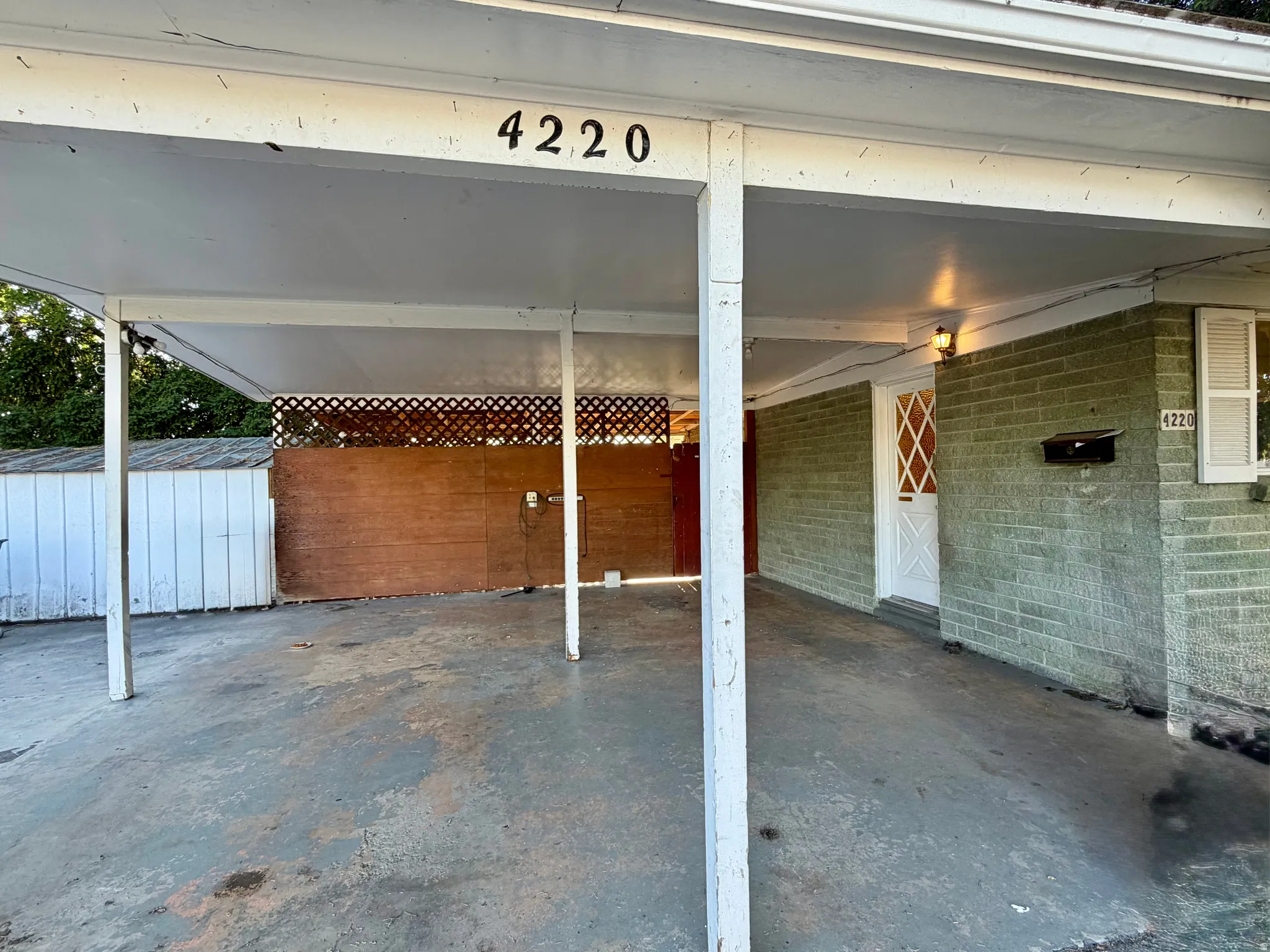 Covered carport offering sheltered parking