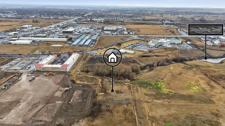 Aerial perspective showcasing broad land parcels and surrounding infrastructure