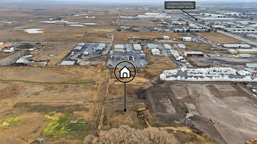 Expansive undeveloped land parcel with surrounding commercial and industrial properties