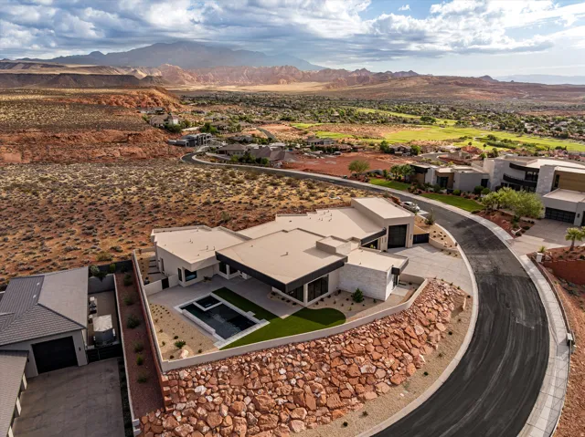 Contemporary residence featuring a flat roofline and a private pool area