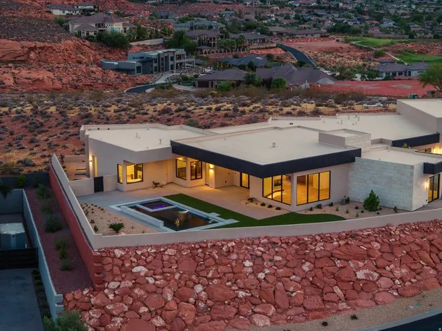 Modern architectural design featuring expansive flat roofs and large format windows