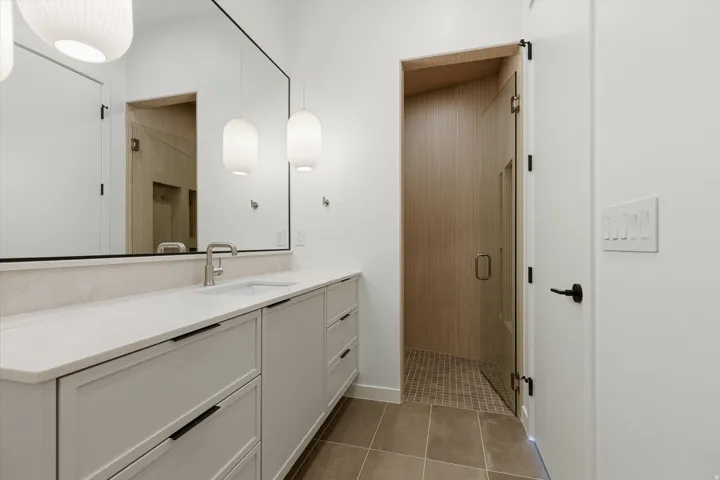 Extended vanity with a rectangular undermount sink and brushed nickel faucet