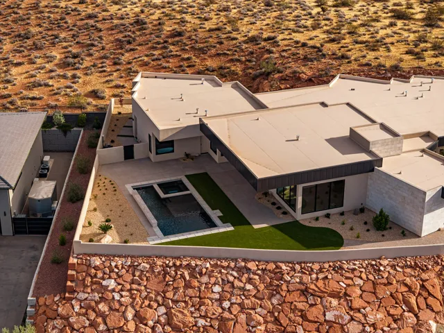 Modern exterior featuring a swimming pool, integrated spa, and artificial turf lawn