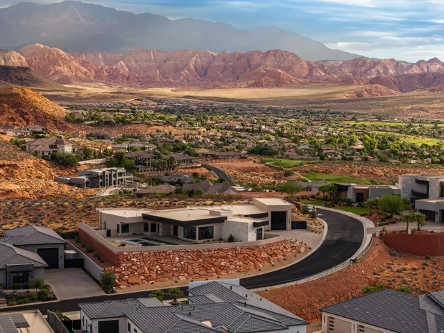 Modern desert-style residence featuring a contemporary exterior, flat roofline, and a private pool