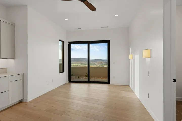 Expansive sliding glass doors opening to outdoor space