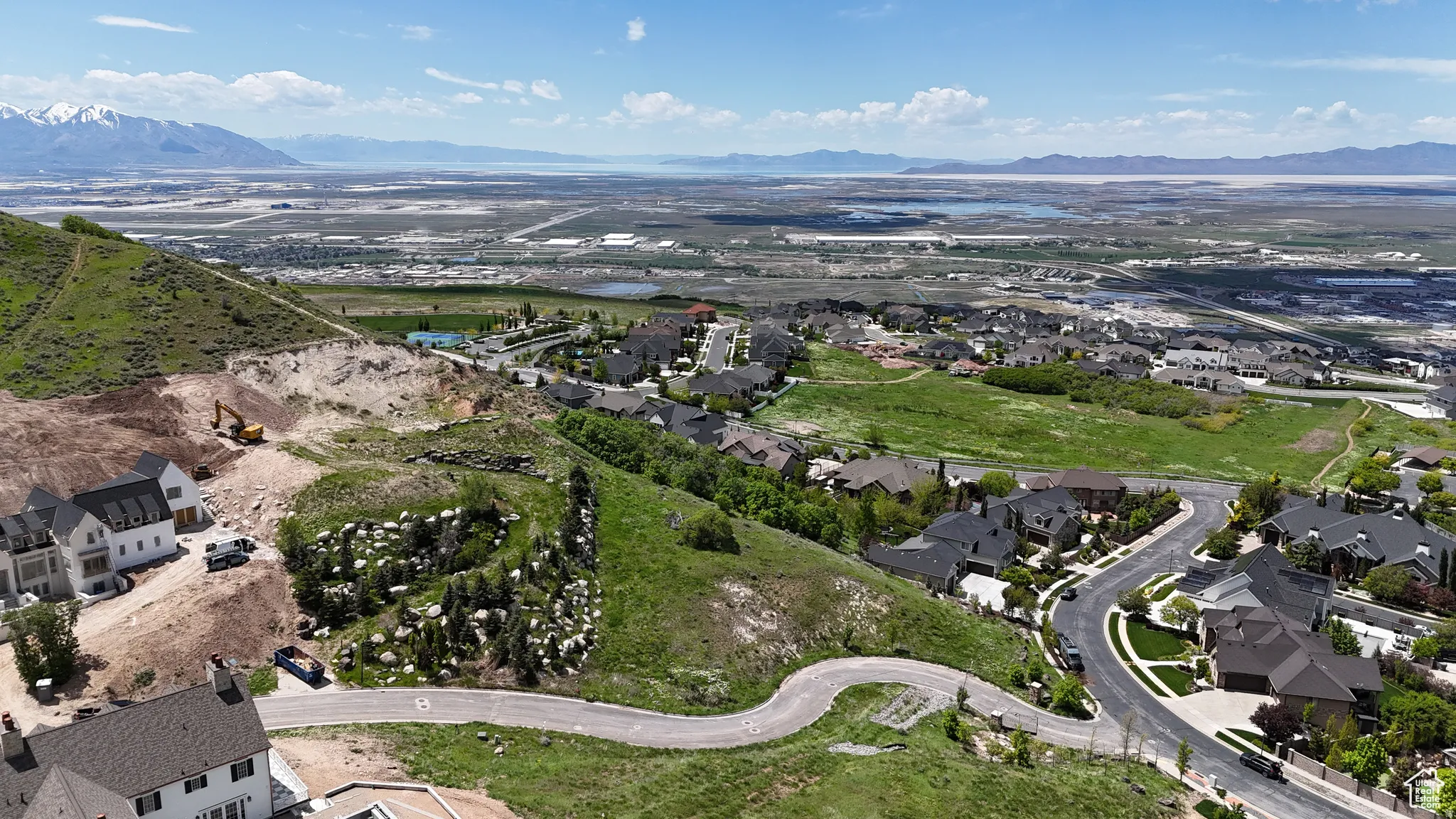 Hillside community with extensive natural landscaping and varying architectural styles