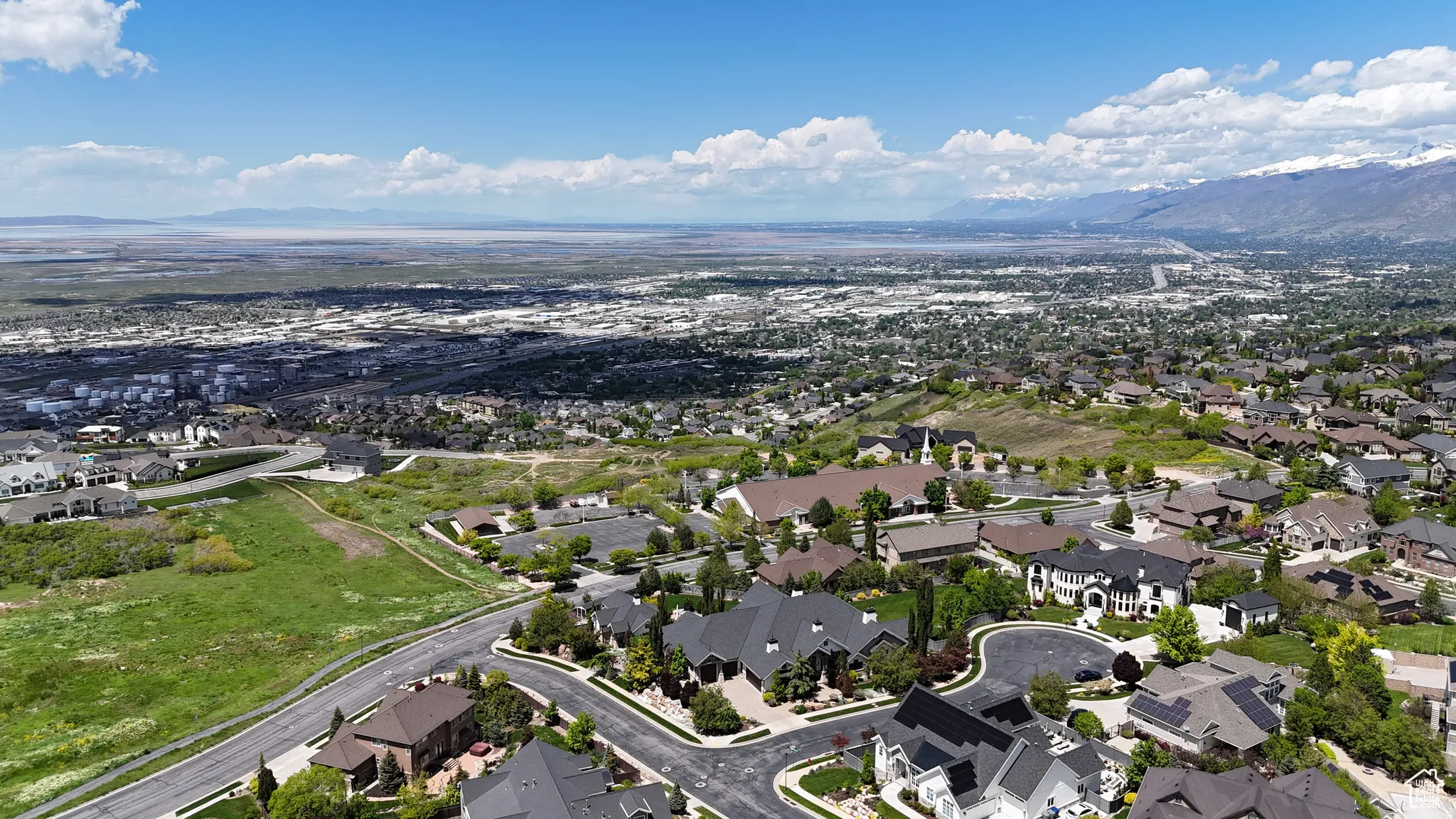 Expansive residential area featuring established homes, paved streets, and abundant greenery