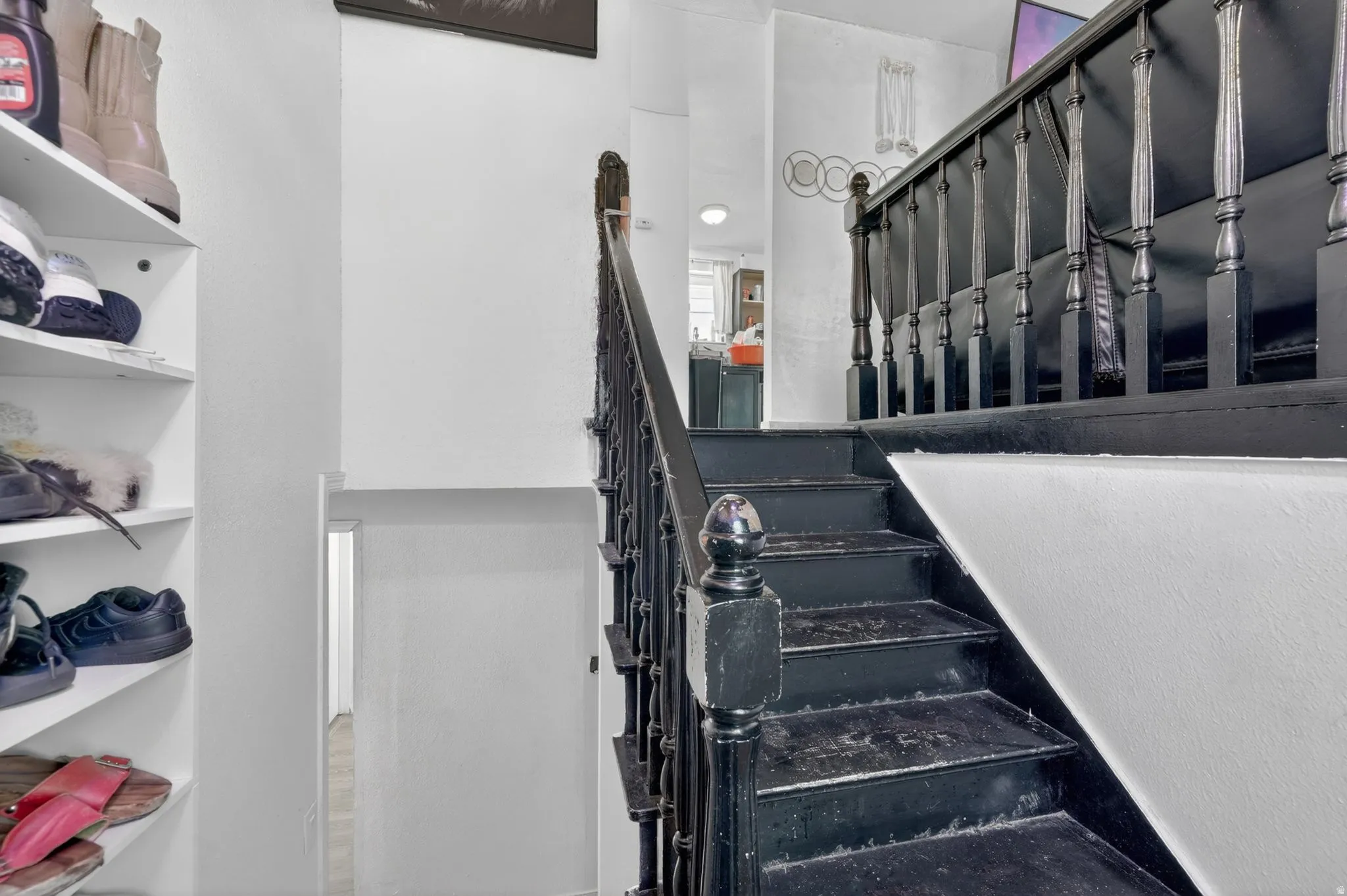 Painted staircase with dark treads and balusters