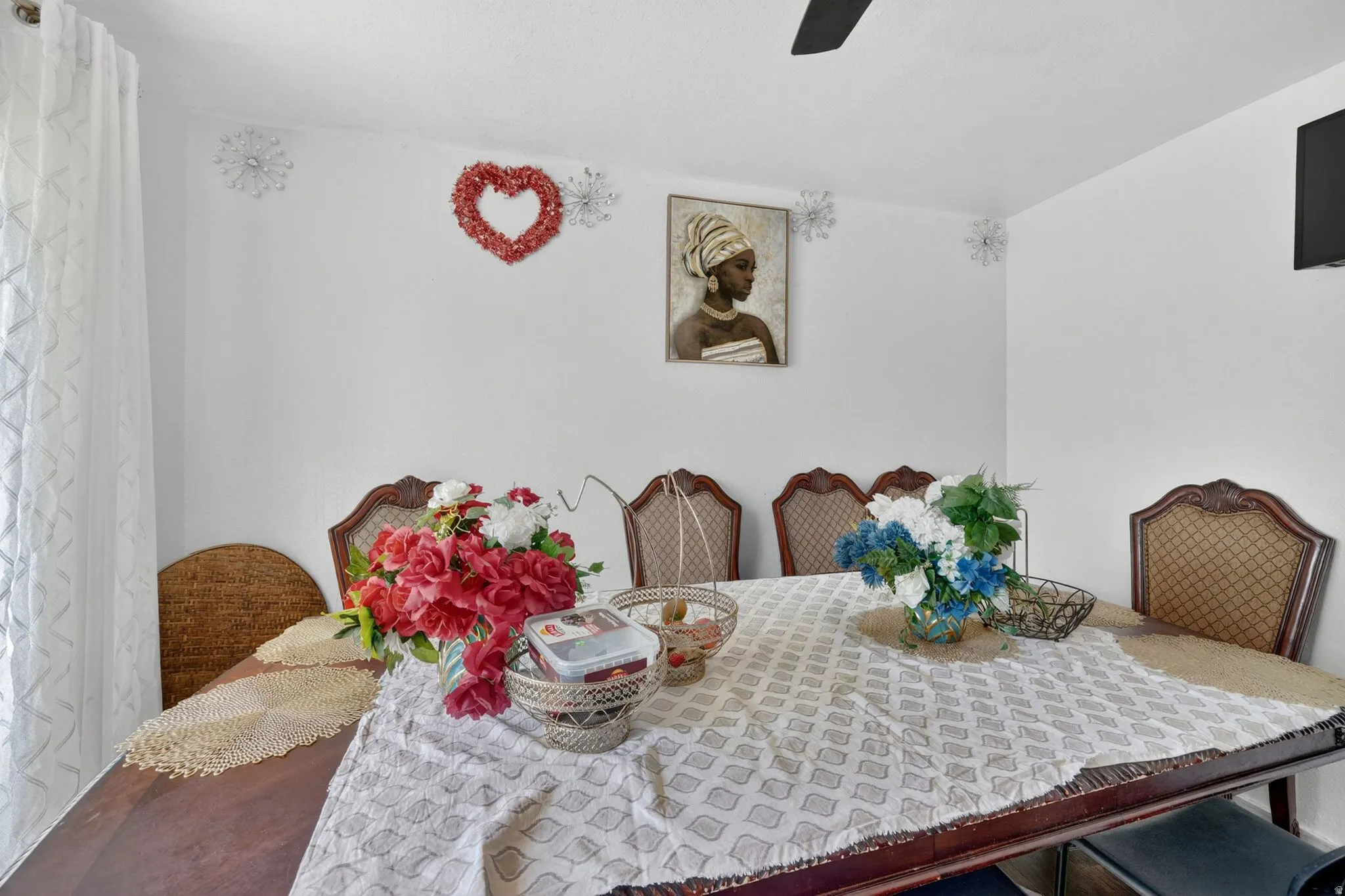 Dining area featuring a dark wood-finish dining table and coordinating upholstered chairs