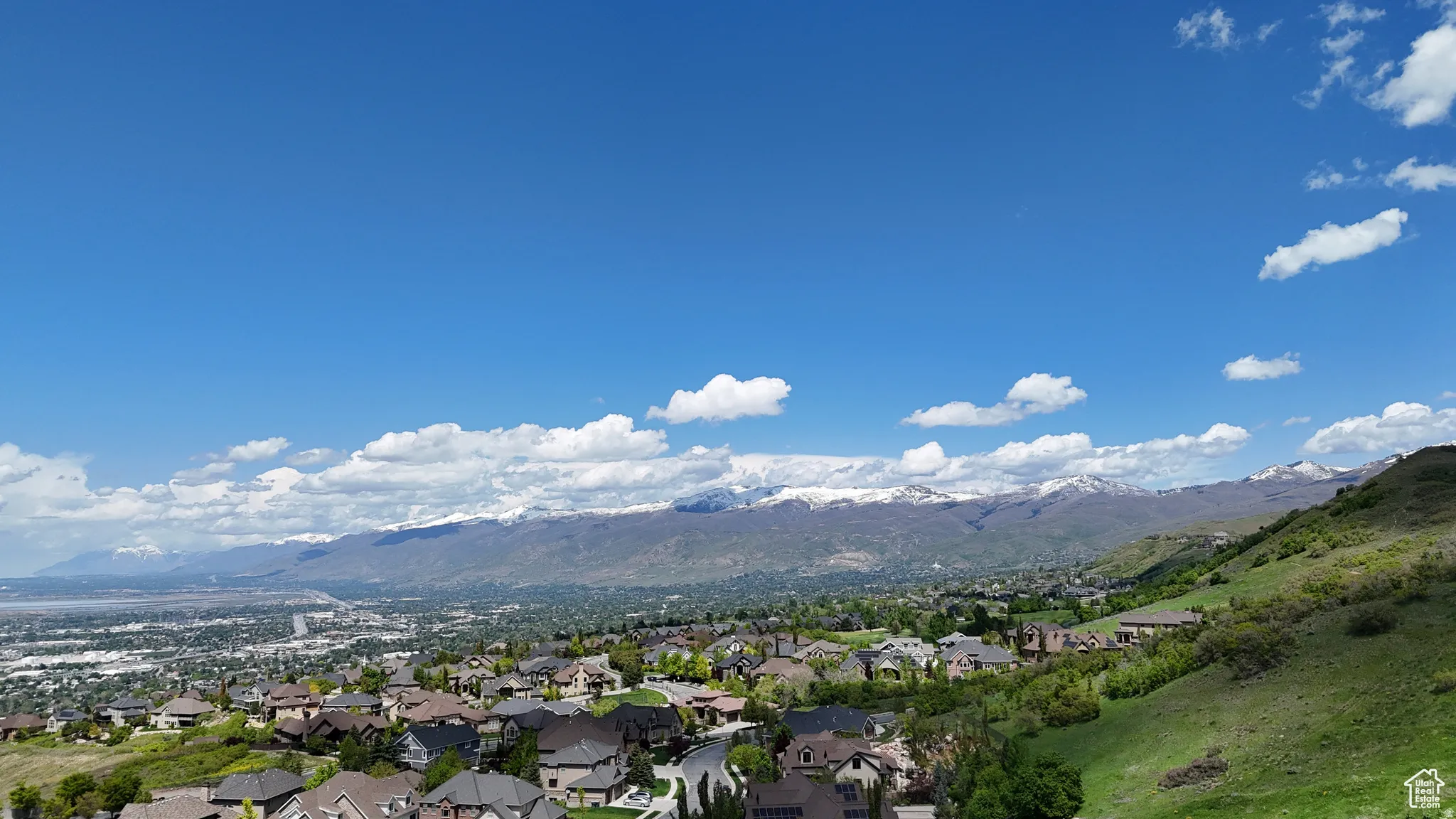 Expansive mountain range backdrop featuring snow-capped peaks