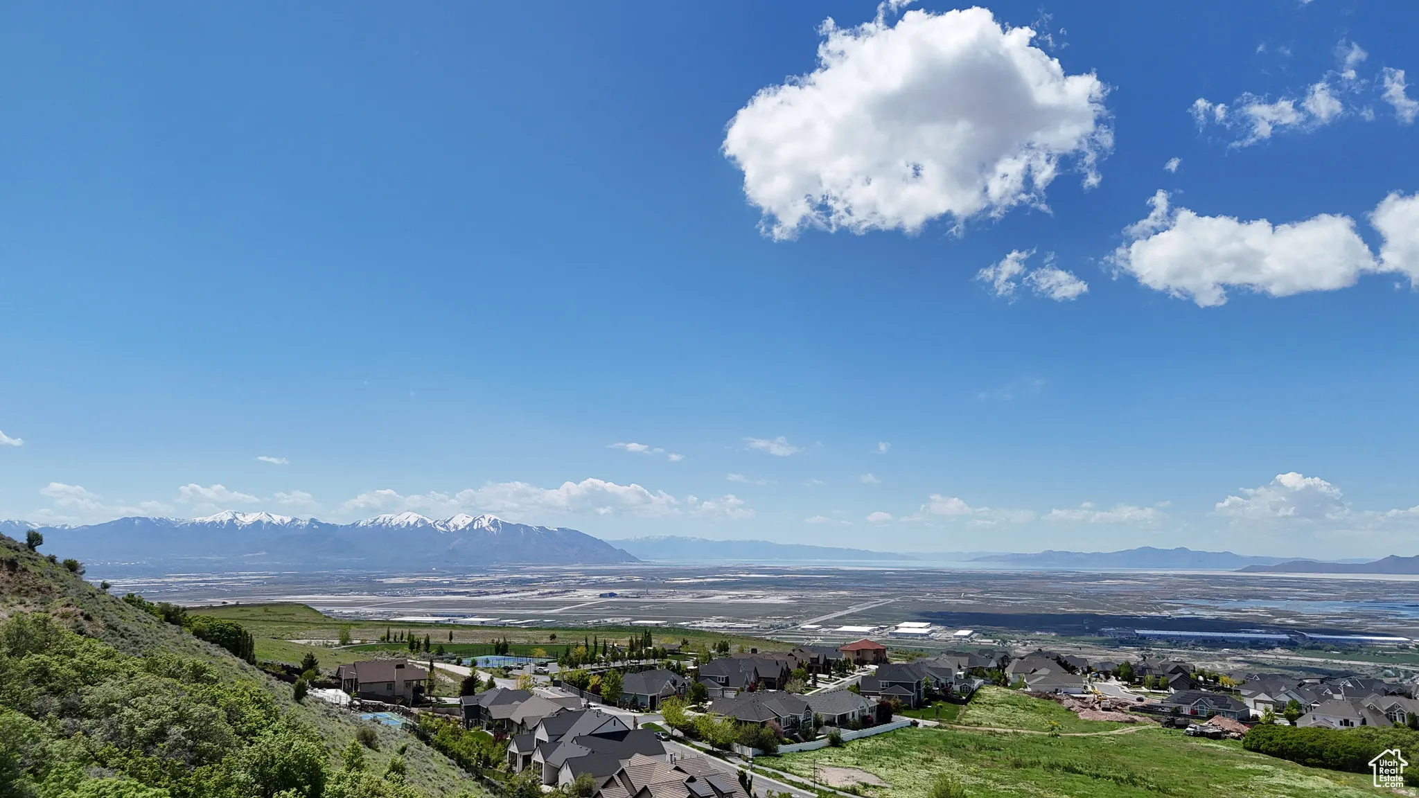 Expansive aerial perspective showcasing a residential area with varied architectural styles