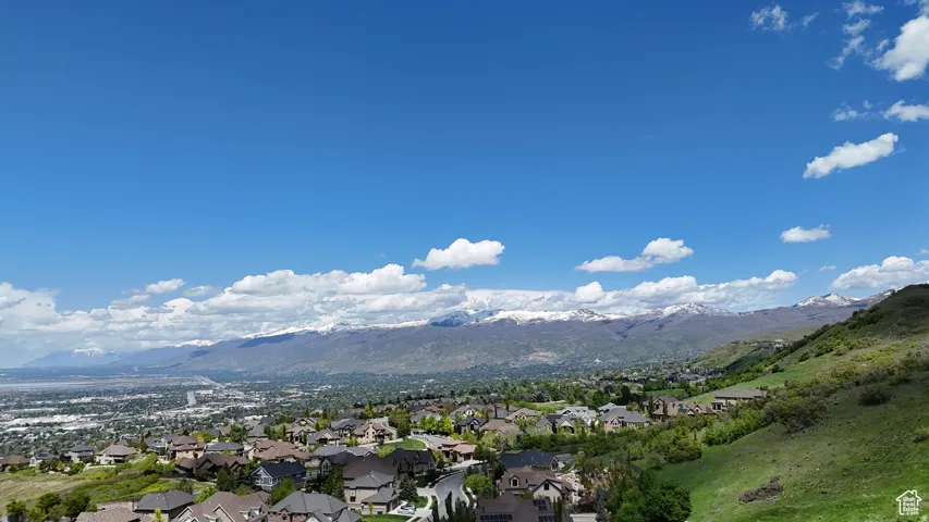 Expansive mountain range backdrop featuring snow-capped peaks