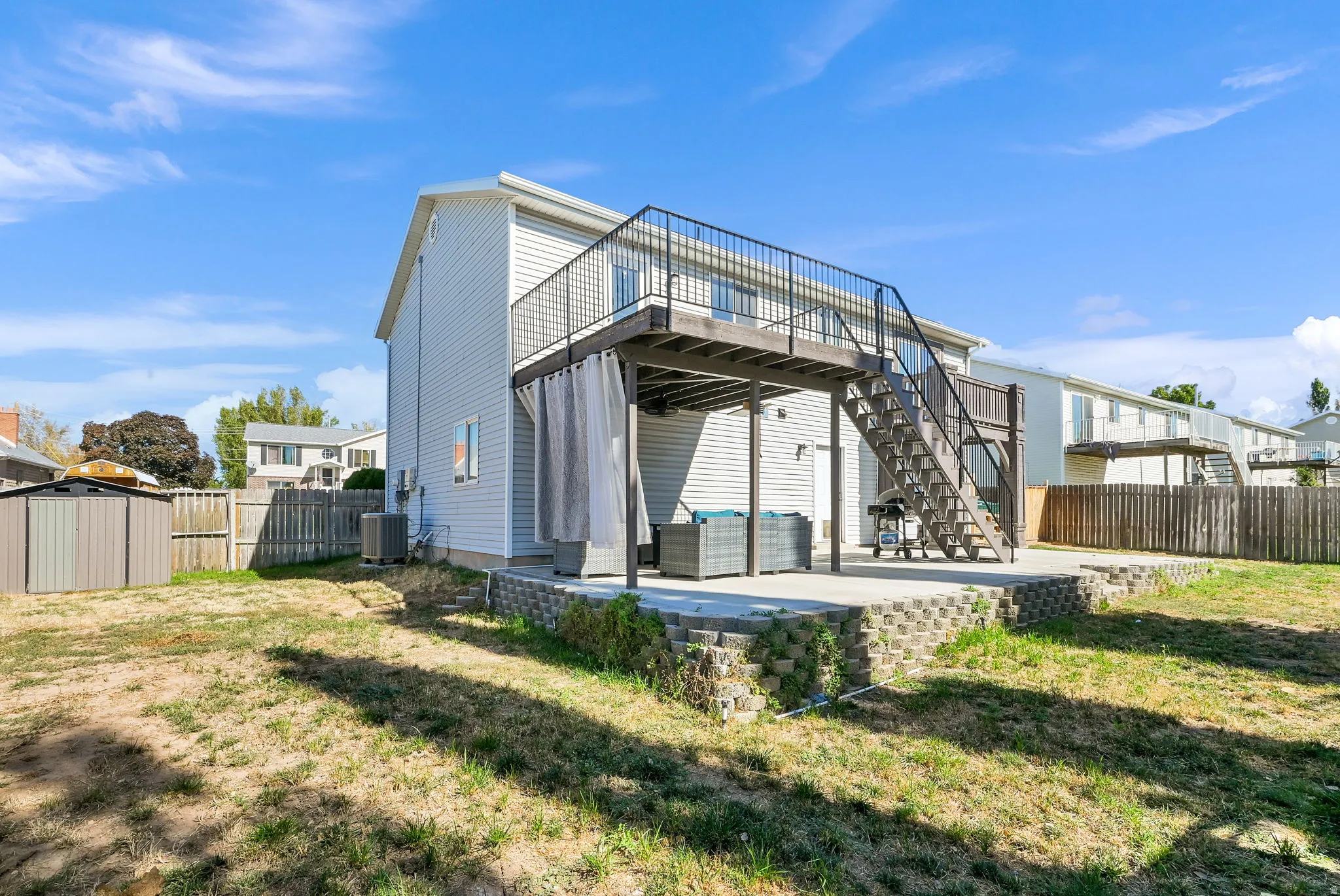 Rear exterior featuring a two-story design with light-colored siding