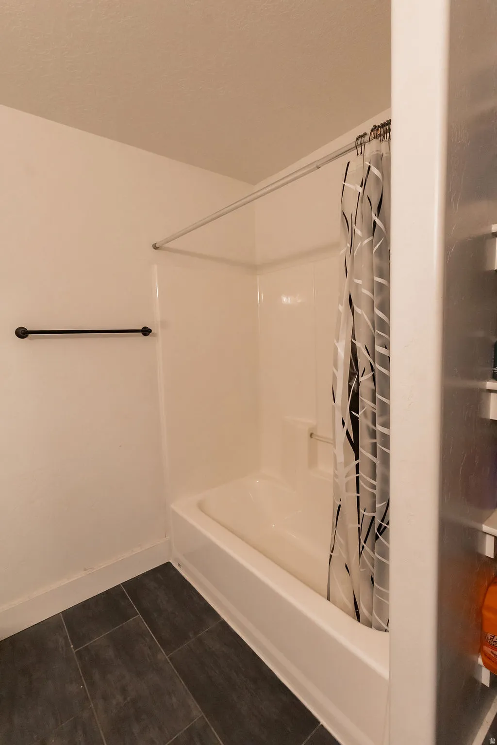 White bathtub and shower combination unit