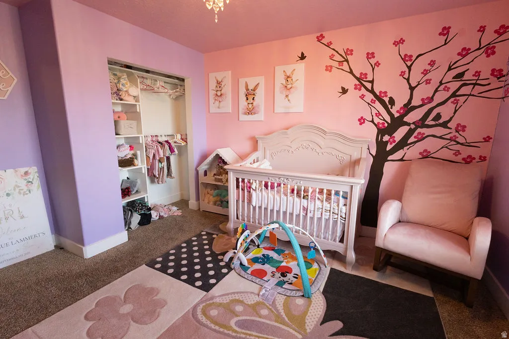 Room featuring a built-in closet with shelving and hanging rods