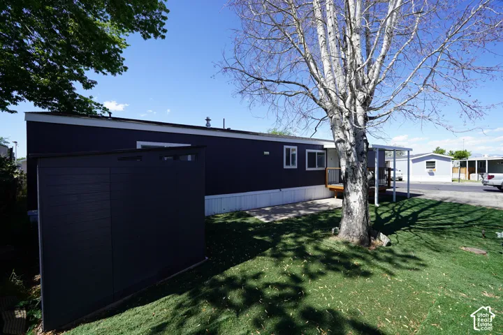Dark blue exterior siding with white trim