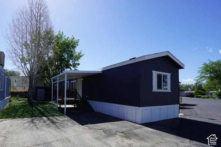 Dark-blue siding with white trim and foundation