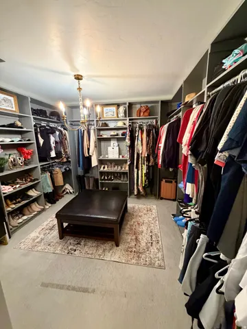 Custom closet system featuring extensive shelving and hanging storage