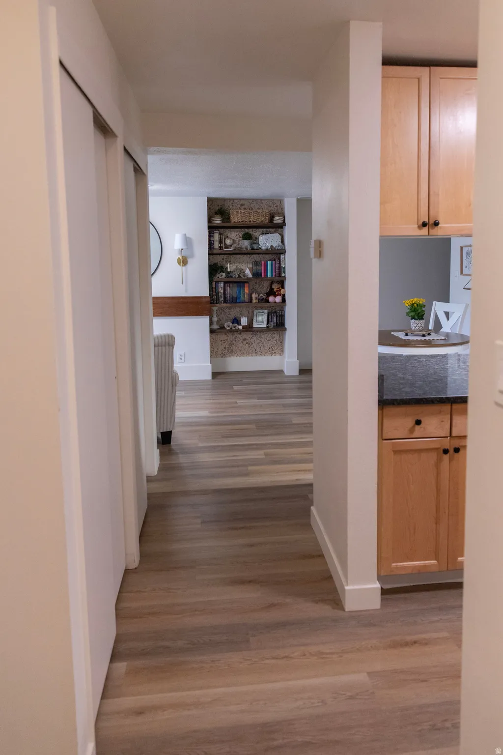 Wood-finish flooring throughout the hallway and living area