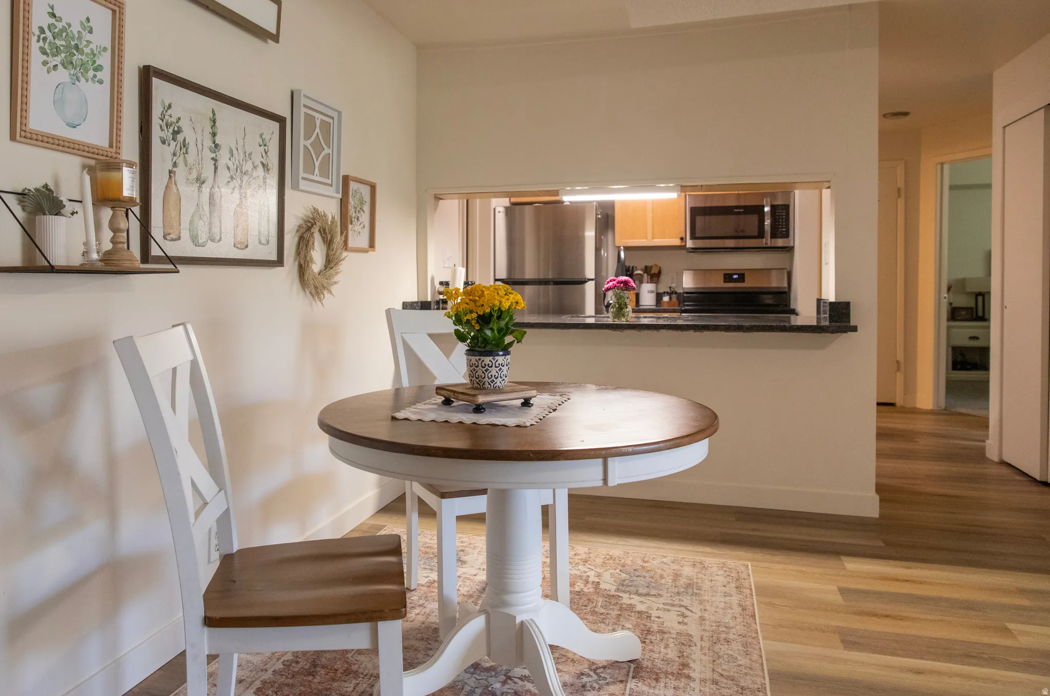 Open concept dining area with wood-finish flooring
