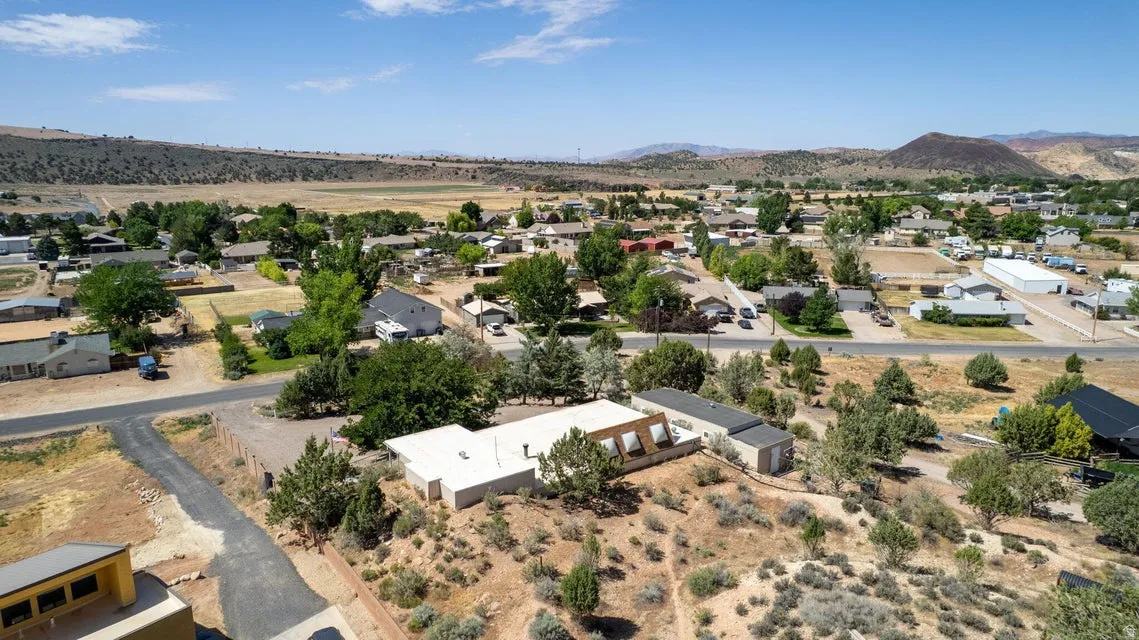 Property with a detached shed and surrounding arid landscape