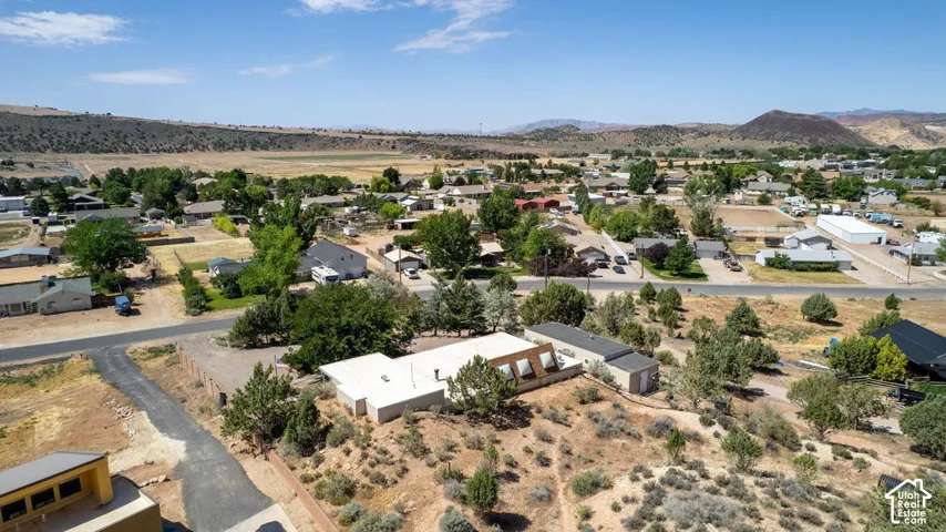Property with a detached shed and surrounding arid landscape