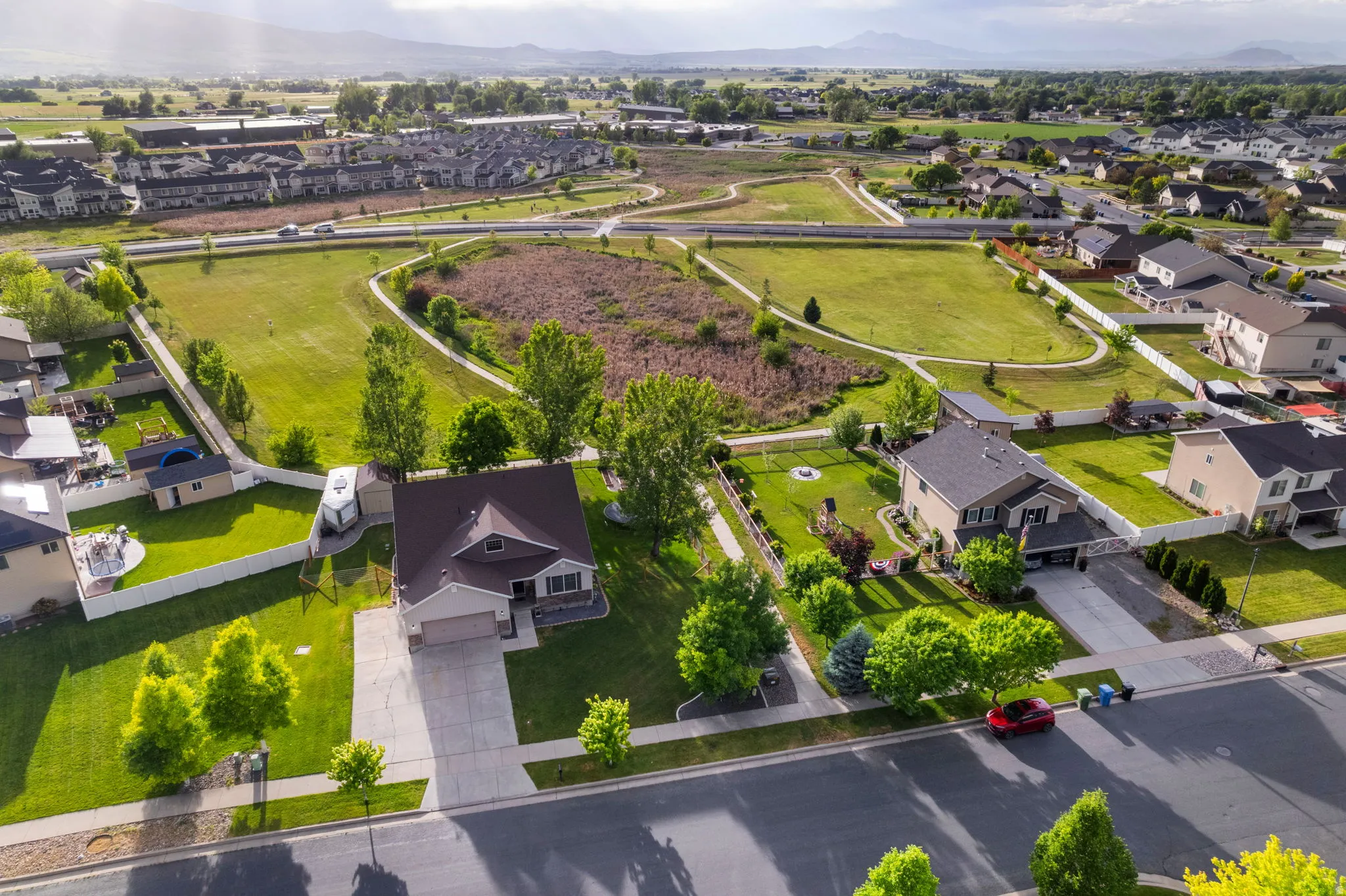 Aerial perspective showcasing a residential neighborhood with green spaces