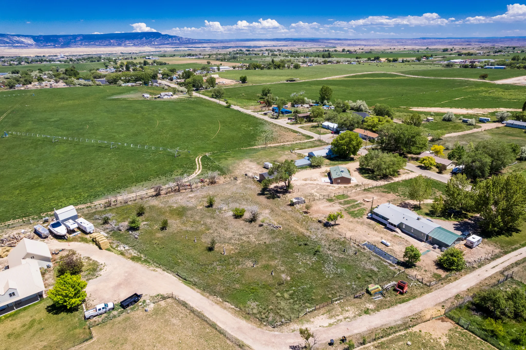 Expansive rural landscape featuring a mix of cultivated fields and undeveloped land