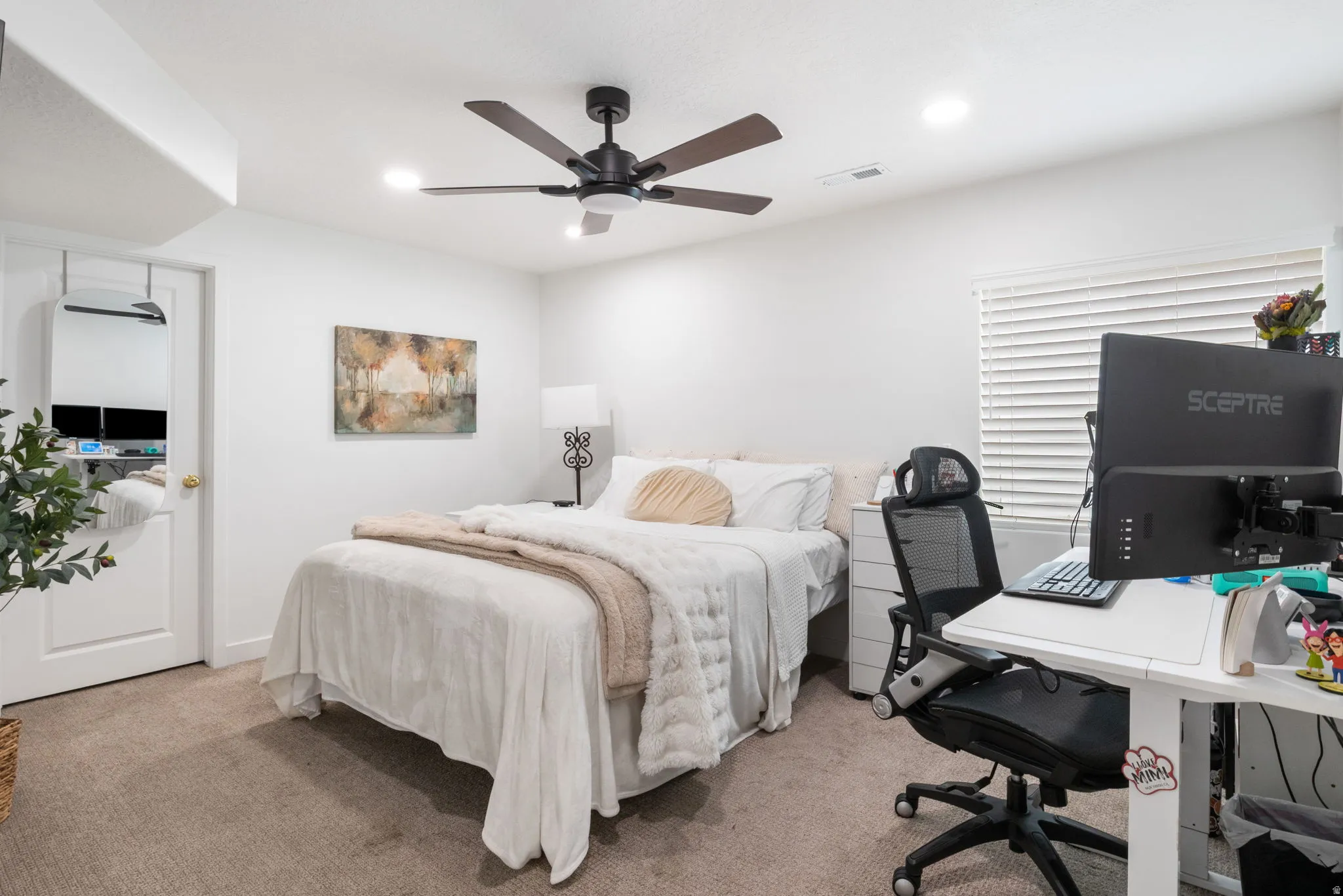 Carpeted bedroom featuring recessed lighting and a ceiling fan with integrated lighting