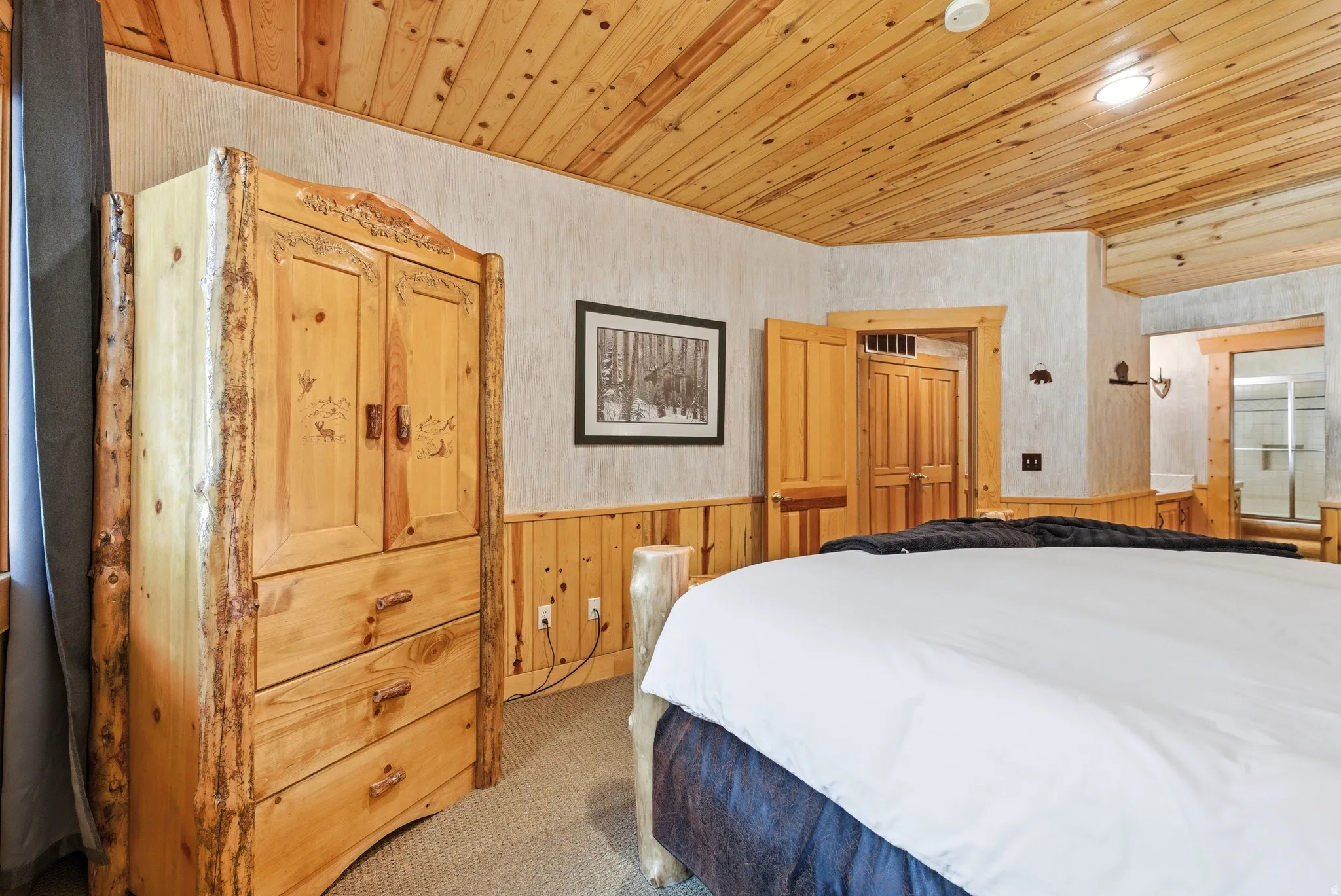 Wood-paneled ceiling with recessed lighting