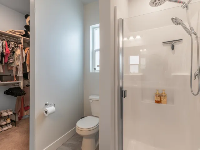 Full shower enclosure with a rain shower head and handheld sprayer