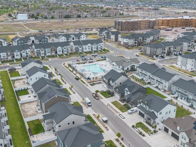 Aerial perspective of a contemporary residential development featuring multiple housing styles