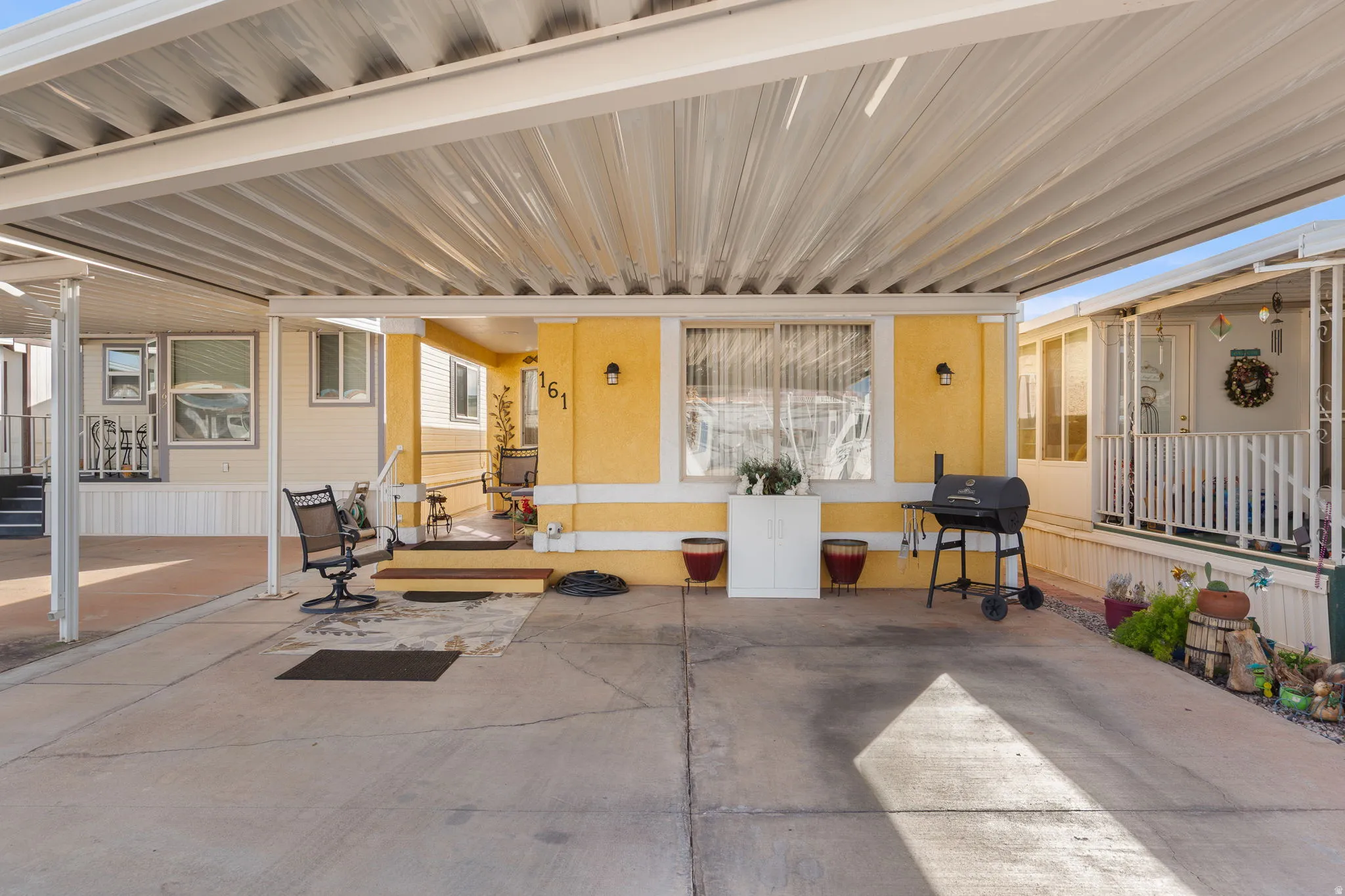 Covered concrete carport with ample space
